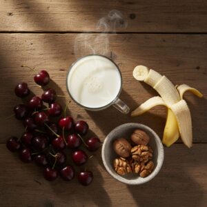 Image 4 - A beautiful arrangement of sleep-promoting foods: a glass of warm milk, a sliced banana, a bowl of walnuts, and fresh tart cherries.