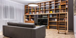 A cozy home library setting with technology integrated for a virtual meeting.
