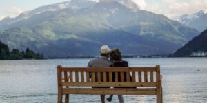 A senior traveler enjoying a beautiful, accessible mountain landscape view.