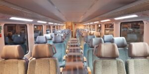 A modern, comfortable train carriage with scenic views, perfect for senior travelers.