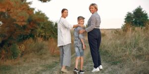 A happy multi-generational family walking along a scenic boardwalk.