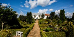 A scenic, accessible path leading to a historic sanctuary during golden hour.