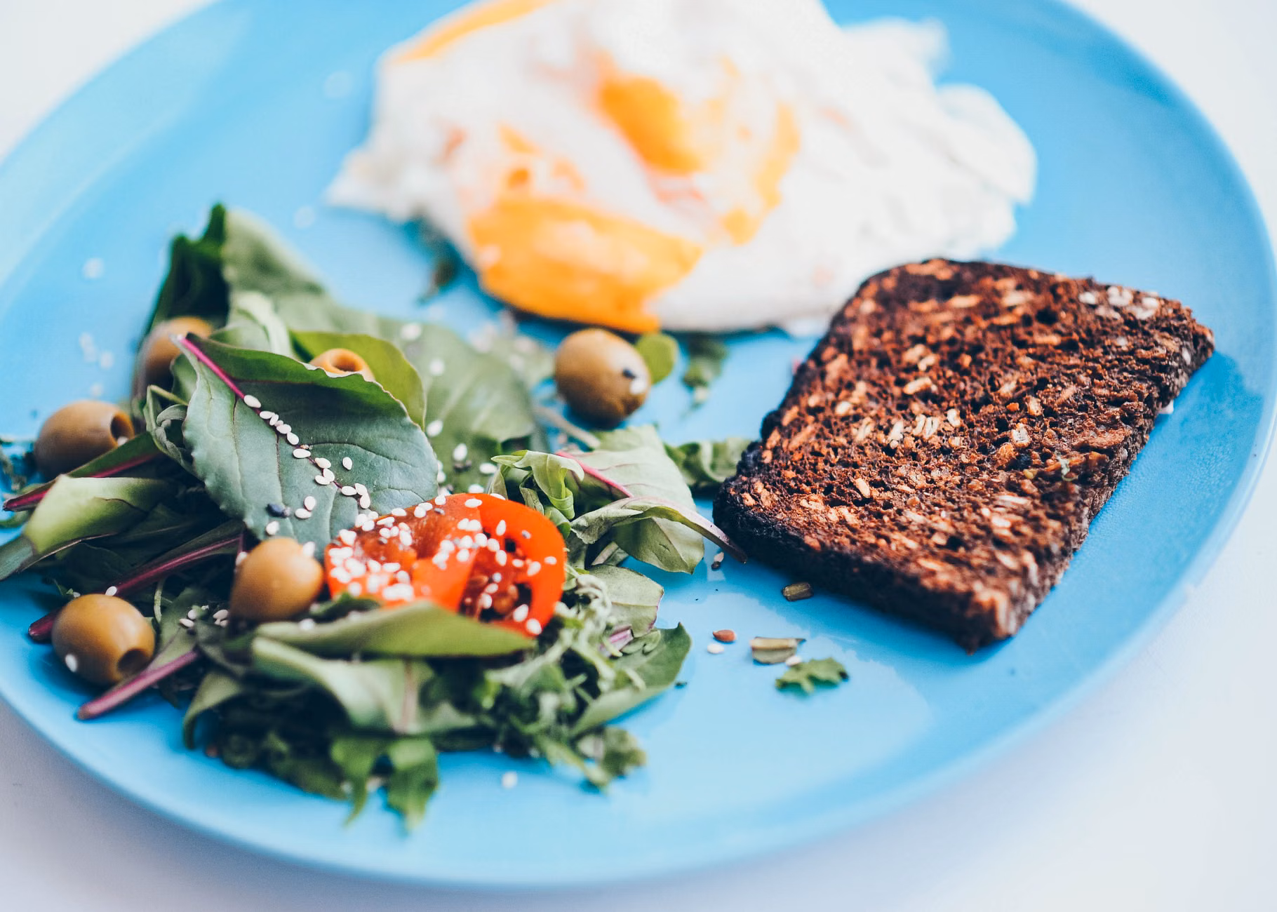 Diverse selection of fiber-rich whole grains and fresh vegetables.