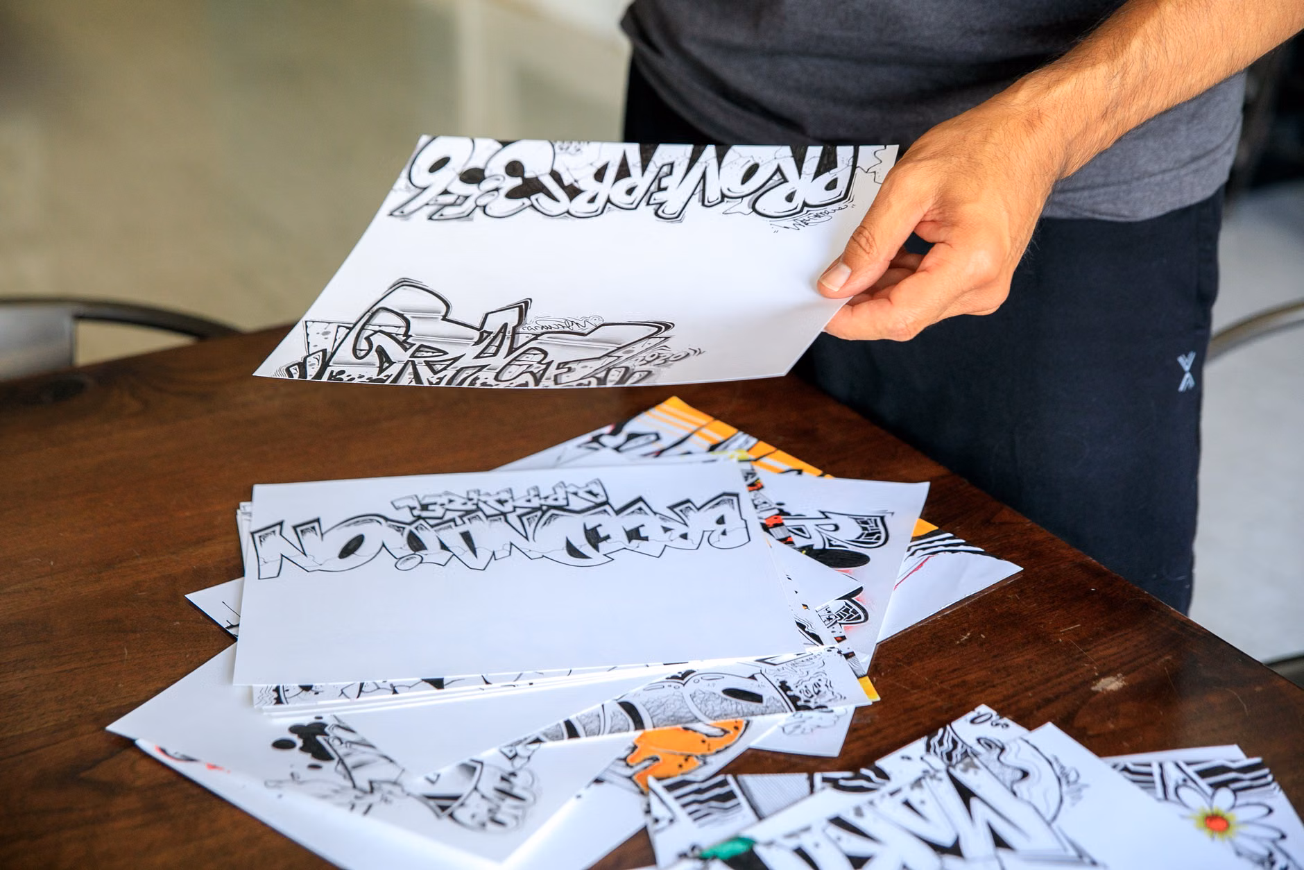 The Joy of Relief Block Printing: A Practical Guide for Creative Leisure 2 Close-up of a person hand-printing a design onto paper.