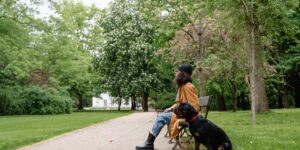 A modern, accessible public park with wide paths and ergonomic seating designed for all age groups.