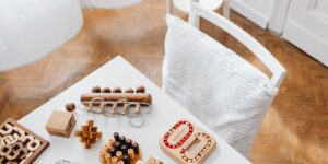 A serene scene of a puzzle on a wooden table with tea and glasses, symbolizing meditative leisure.