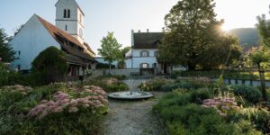 A scenic, accessible path in a historic rural village bathed in morning light.