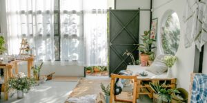 A peaceful artist's workspace in a sunlit room with watercolor supplies.