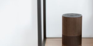 A modern, accessible living room featuring a smart speaker, representing the future of senior-friendly AI technology.