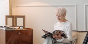 A bright, modern senior-friendly living room featuring an air purifier and natural light.