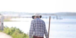 A scenic view of a walking stick in a historic city setting, representing senior travel.