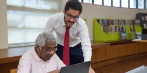 A modern, accessible library setting welcoming seniors to digital services.