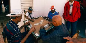 A group of seniors enjoying a board game together in a community setting.