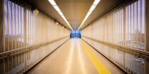 A brightly lit, accessible urban walkway designed for senior safety at twilight.