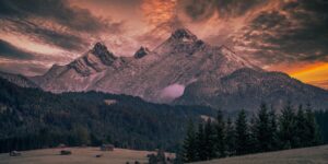 A peaceful mountain landscape at sunset, symbolizing a relaxing senior retreat.