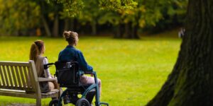 A scenic, accessible public park with wide paths and comfortable seating, designed for seniors.
