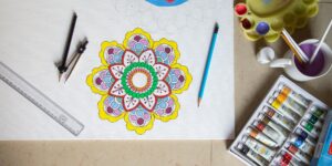 An elderly person coloring an intricate mandala design in a quiet, well-lit room.