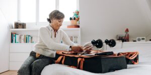 A peaceful living room setting with a senior preparing for light mobility exercises.