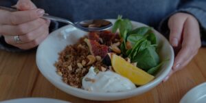 A healthy meal with leafy greens and nuts representing magnesium-rich nutrition.