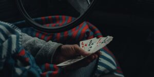 A cozy scene featuring a deck of cards and a cup of tea on a wooden table, symbolizing a relaxing hobby for seniors.