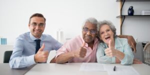 An older couple checking into a hotel, representing senior-friendly travel.