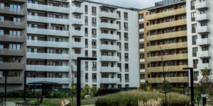 A modern intergenerational housing complex with accessible green spaces.