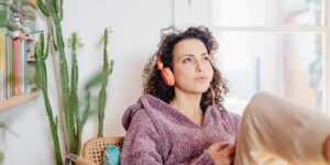 A person sitting comfortably in a well-lit living room, emphasizing mobility and wellness.