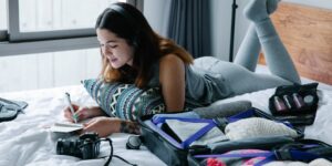 A well-organized set of travel essentials including a suitcase, pillow, and shoes for senior travelers.