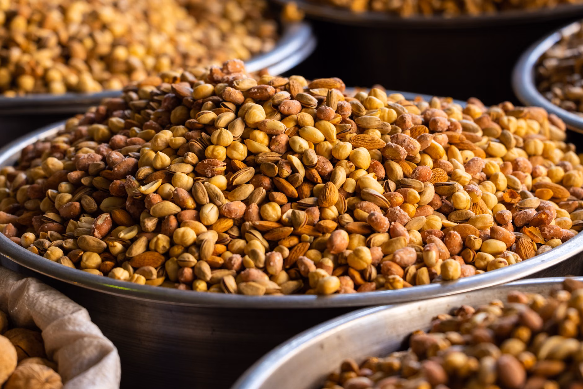 A variety of nuts and seeds rich in copper placed on a kitchen counter.