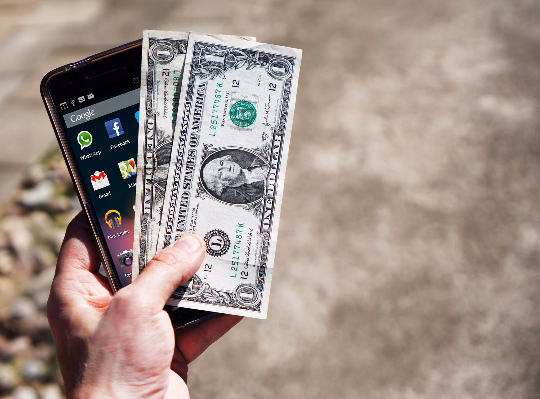 Hands using a high-contrast, accessible banking app on a smartphone.