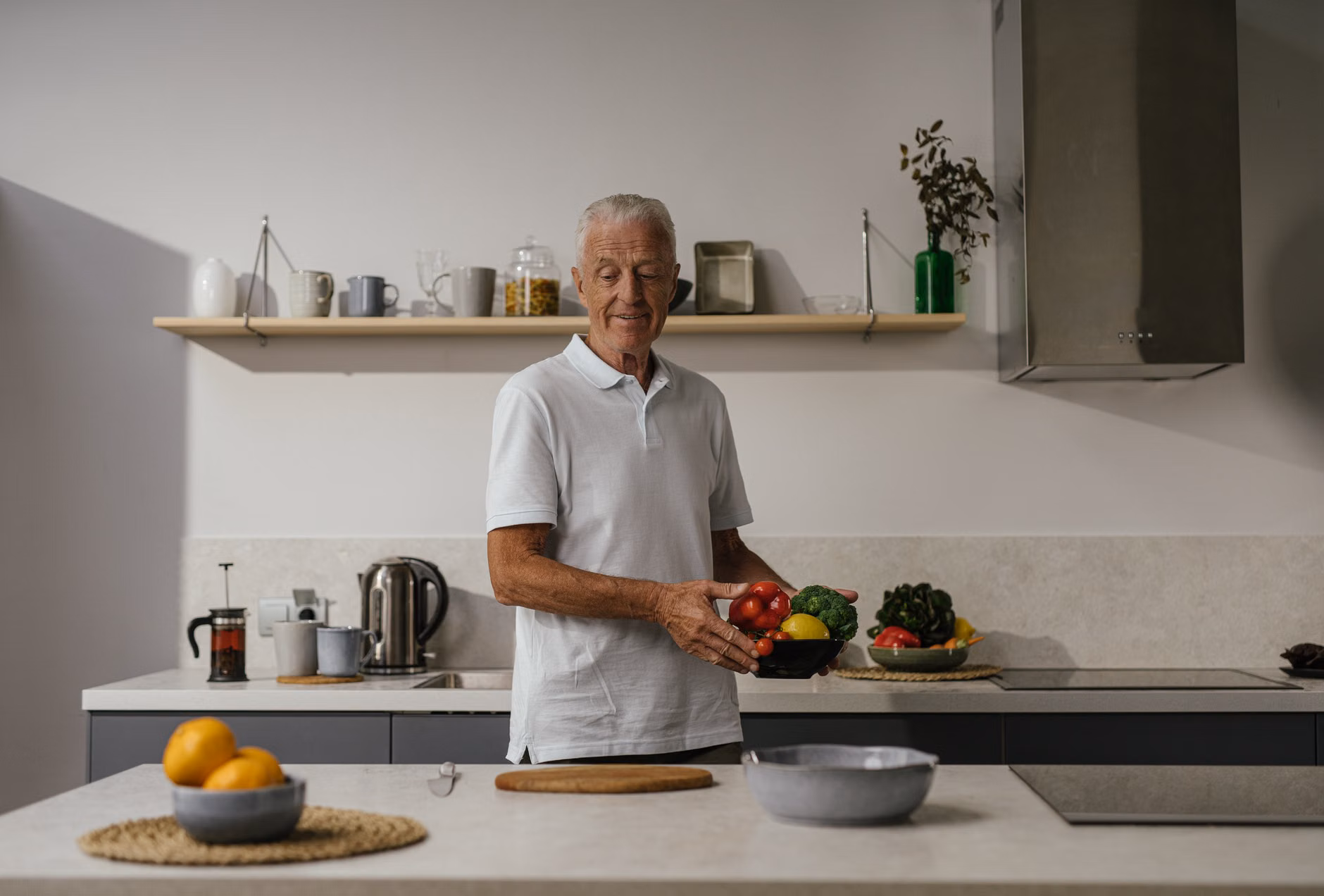 Maintaining Cartilage Health: The Role of Dietary Manganese for Seniors 1 A senior adult preparing a nutritious meal in a kitchen.