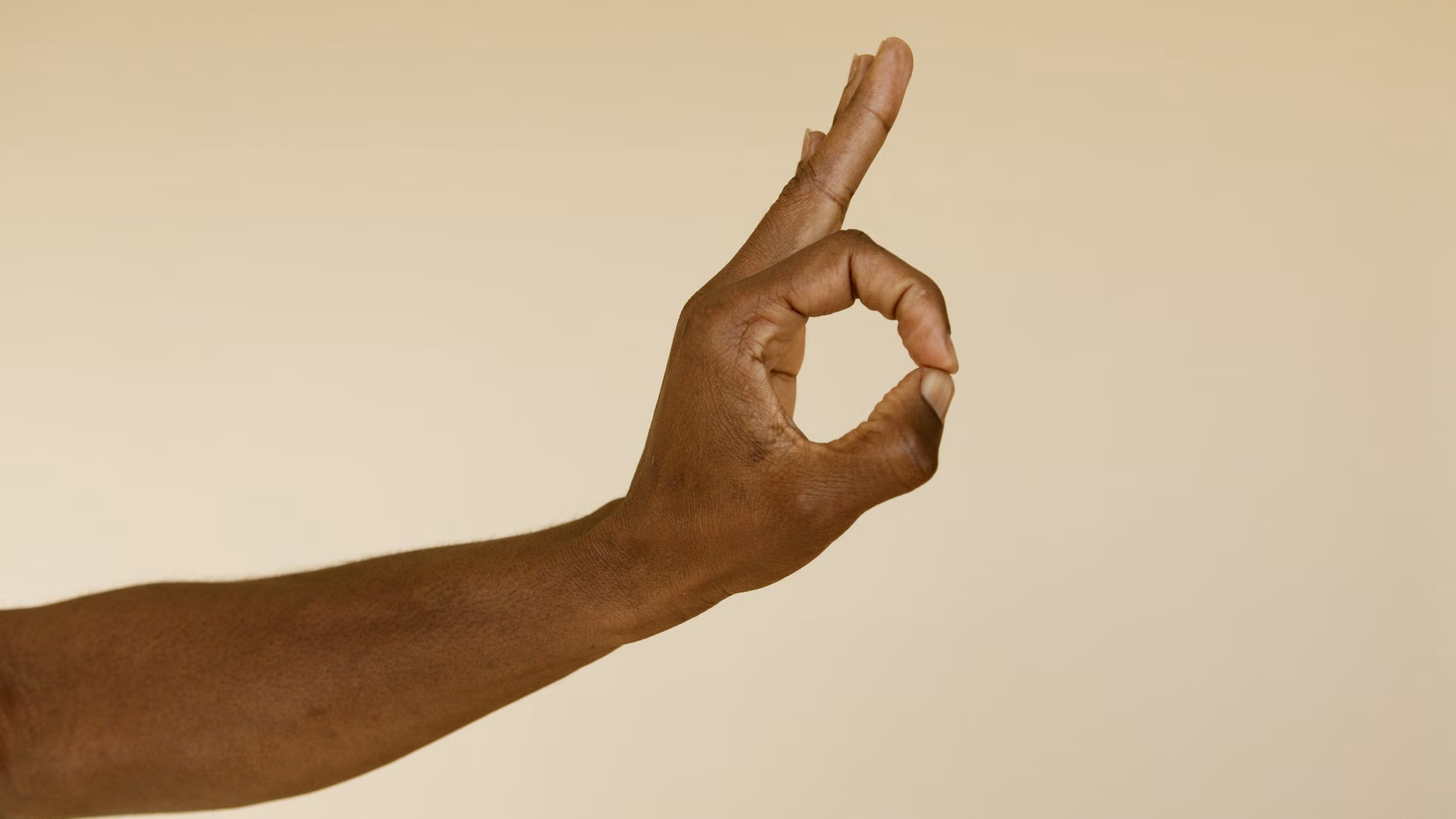 Seated Finger-Flicks: A Practical Guide to Maintaining Fine Motor Skills 1 Close-up of fingers positioned for a flicking exercise.