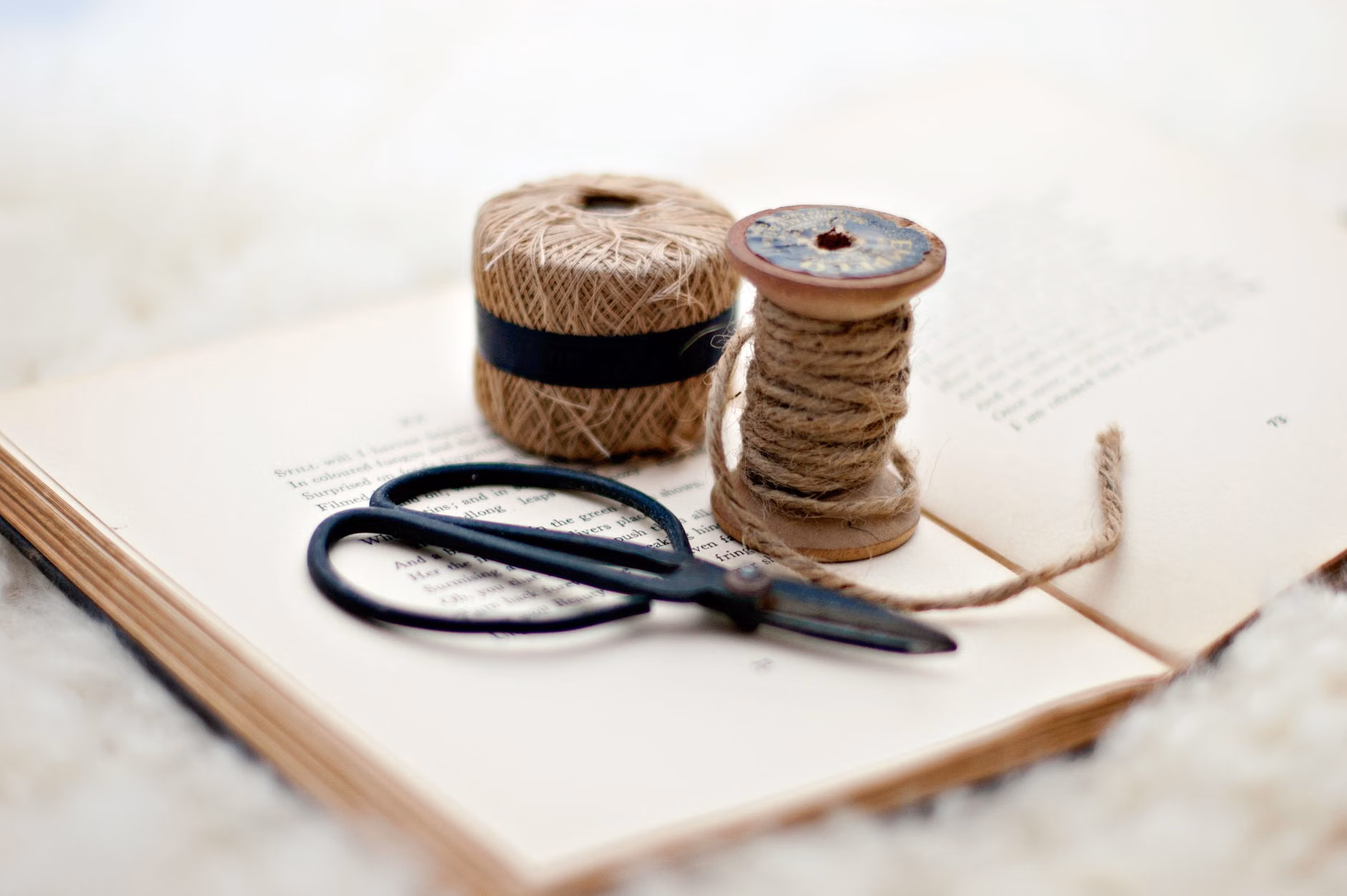The Art of Bookbinding: A Mindful Hobby for Precision and Cognitive Wellbeing 1 Collection of bookbinding supplies including decorative paper and linen thread