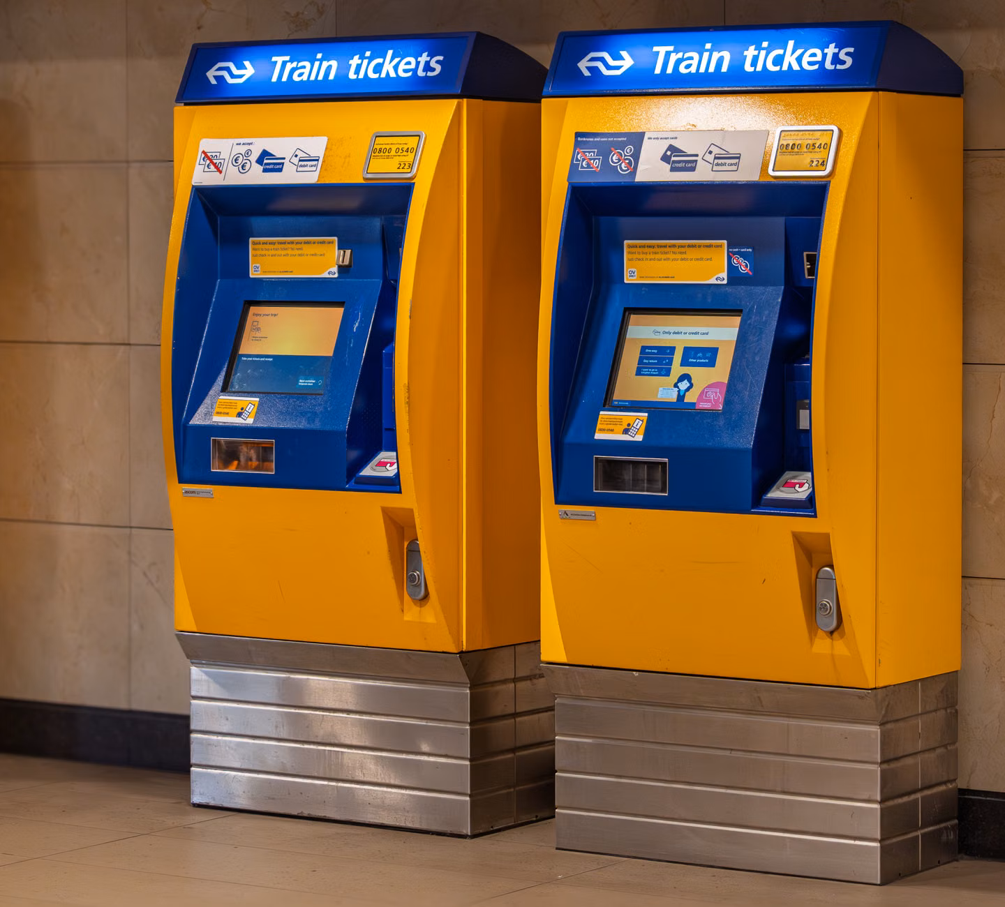 A senior traveler checking a digital train ticket on a smartphone.