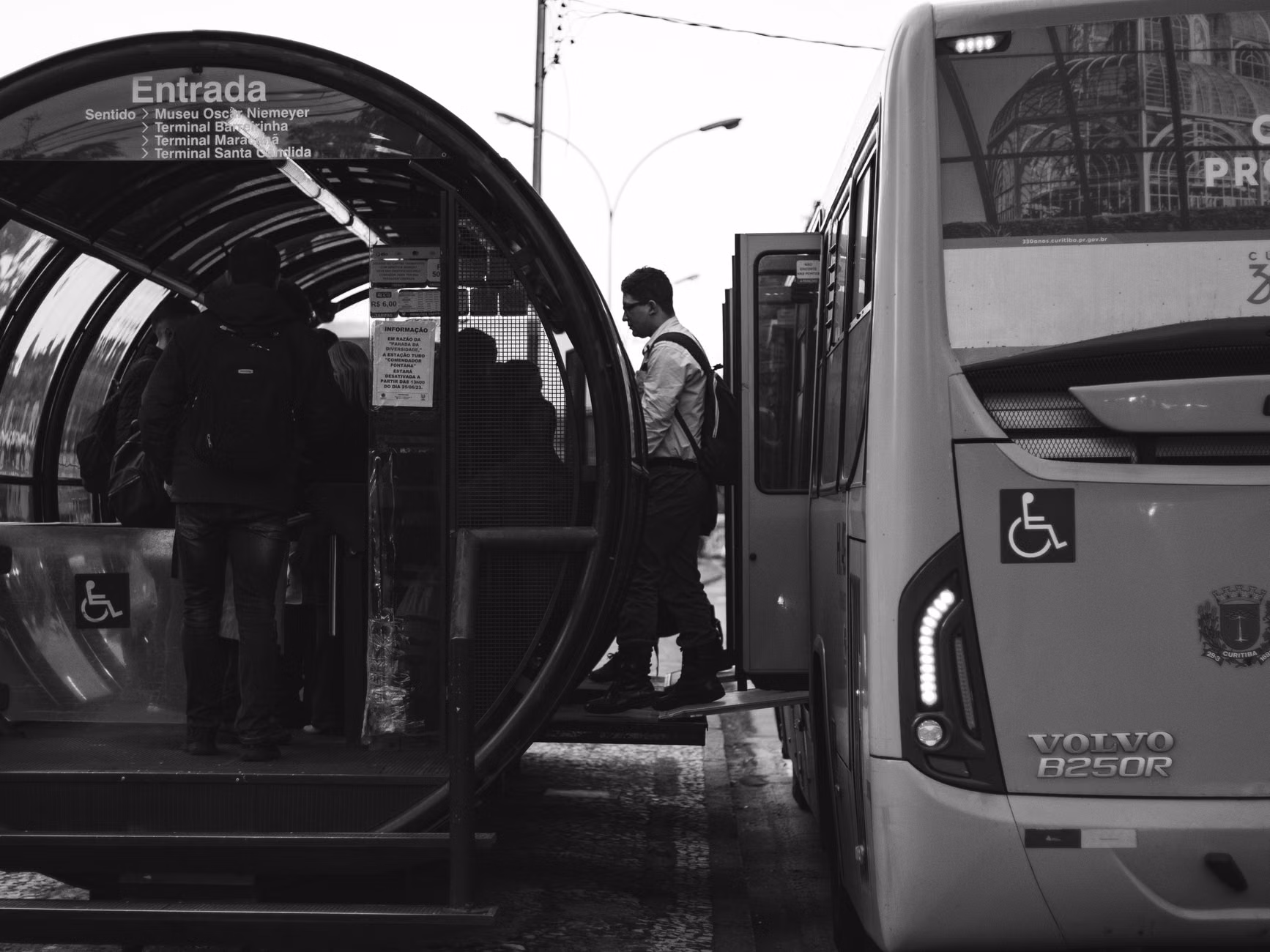 Senior citizen boarding a modern, accessible low-floor city bus.