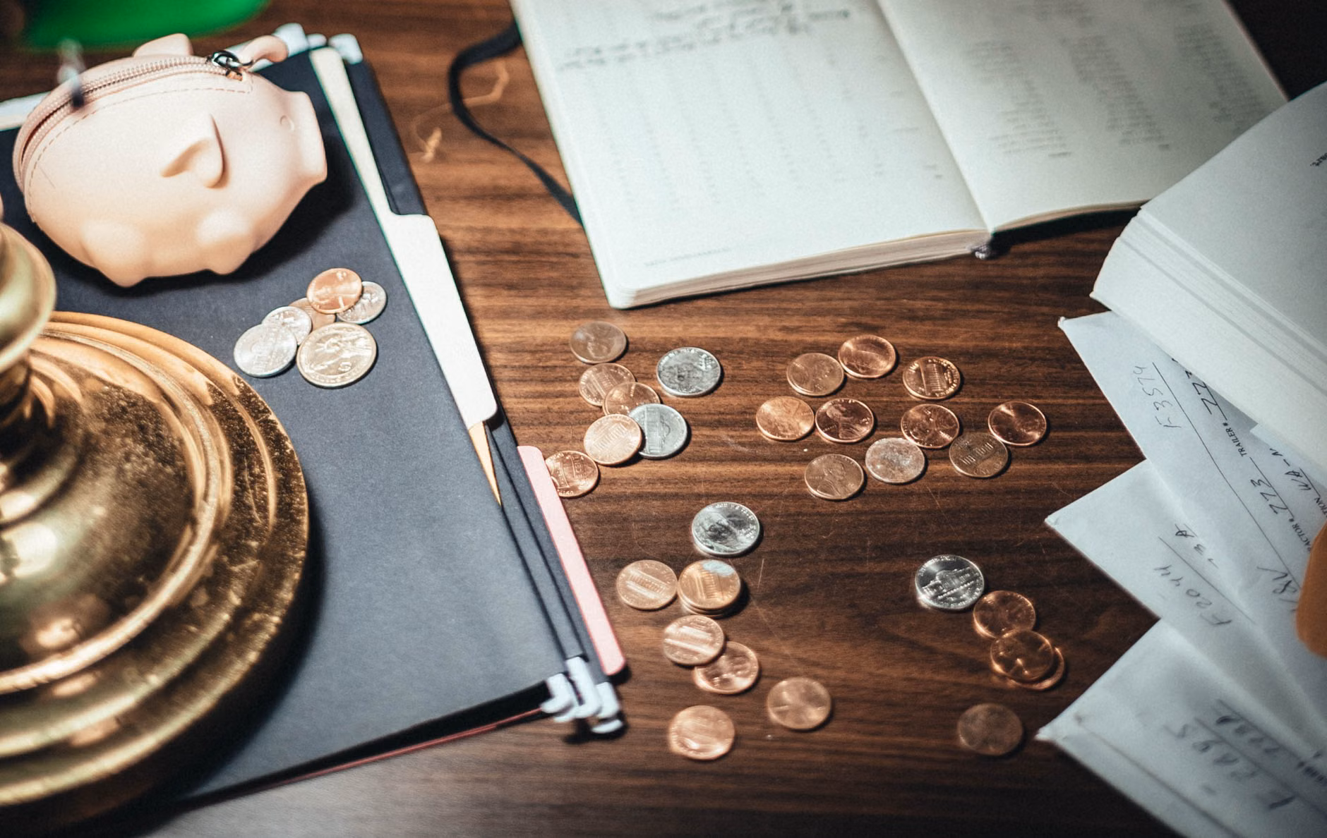 A desk setup for organizing personal financial and pension documents.