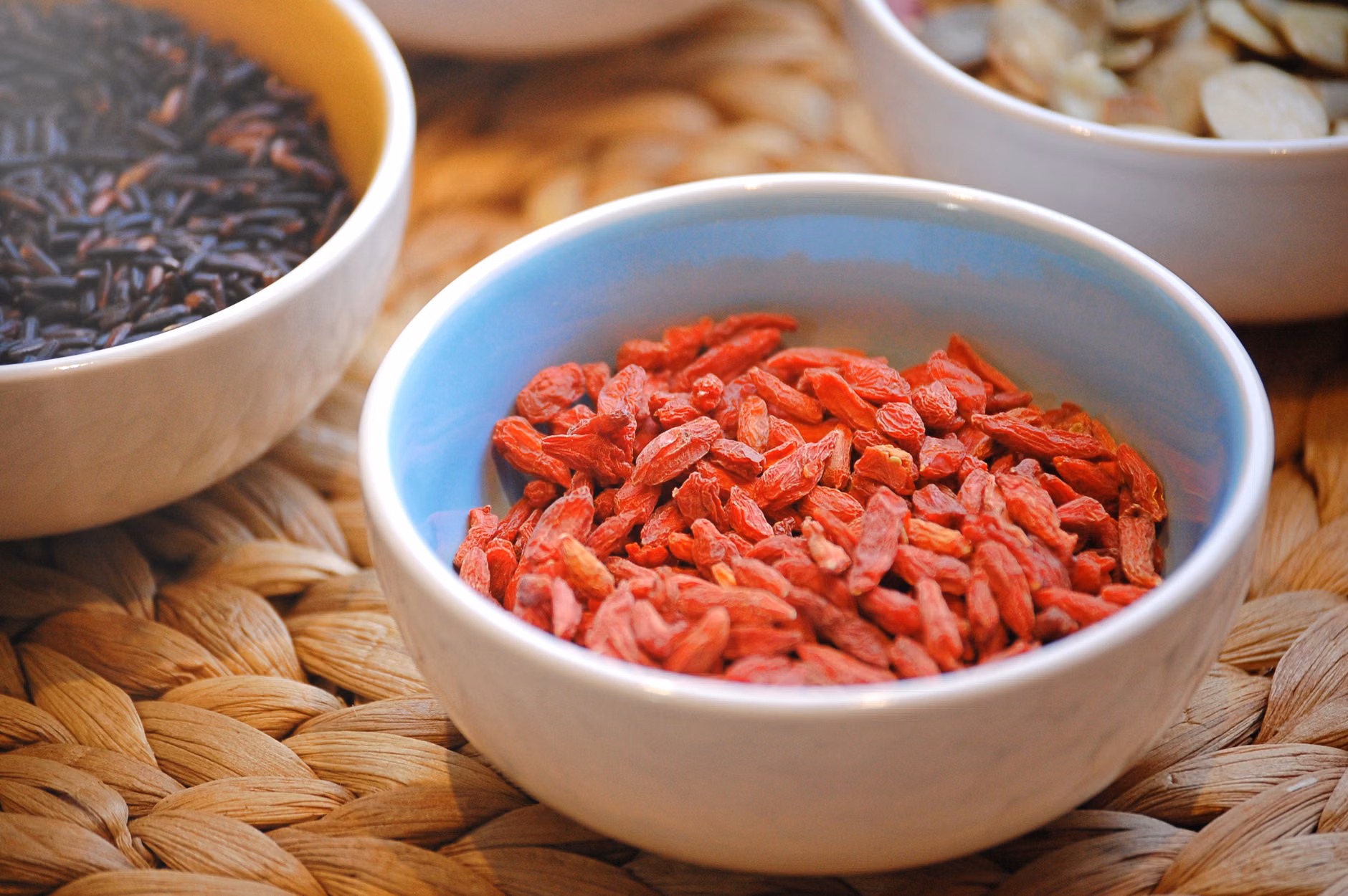A variety of plant-based zinc sources in small bowls.
