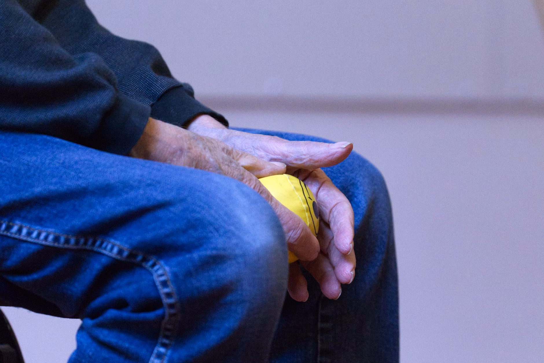 Seated Finger-Flicks: A Practical Guide to Maintaining Fine Motor Skills 2 A senior demonstrating proper seated posture for hand exercises.