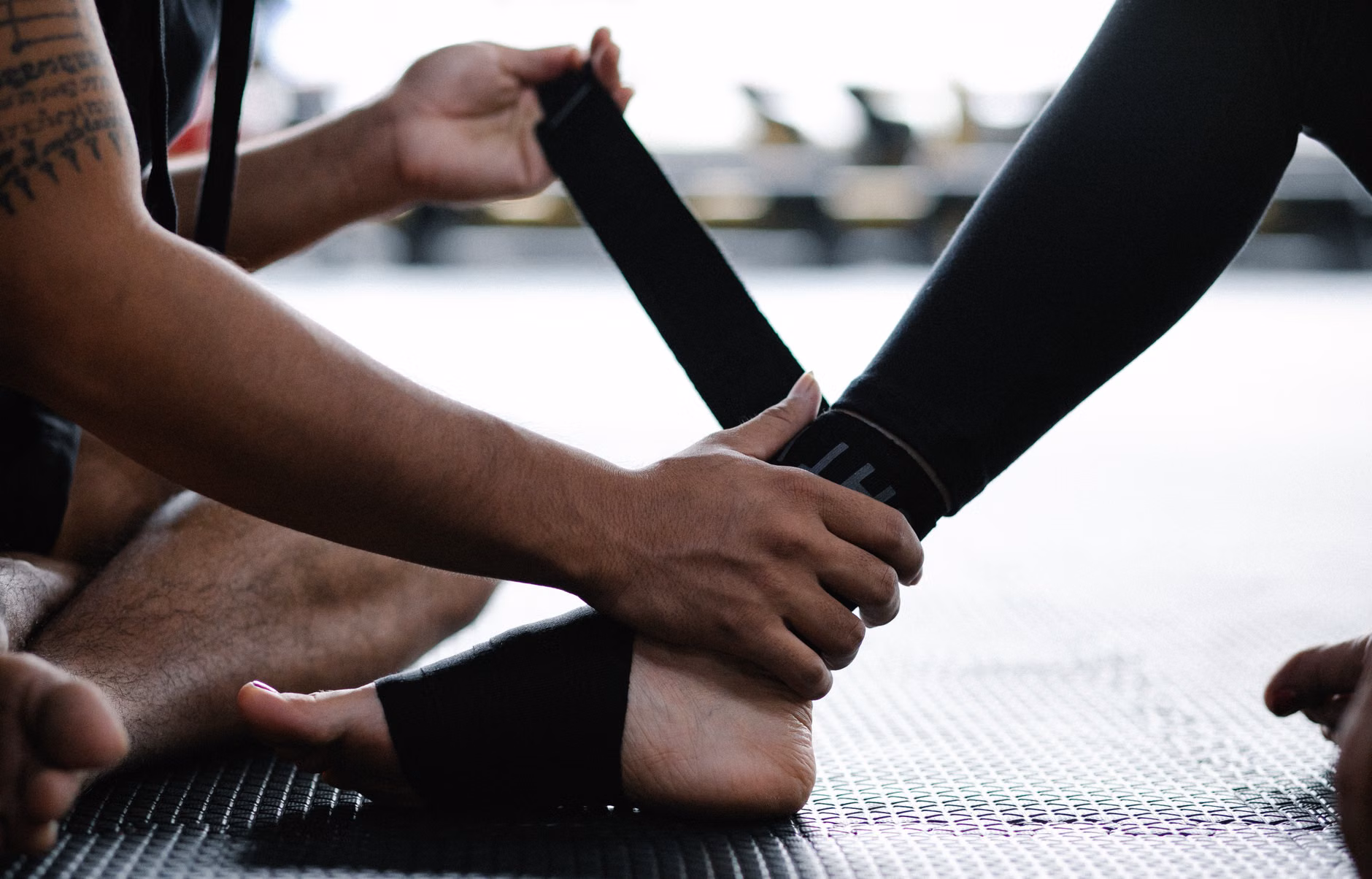 Proper seated posture for ankle mobility exercises.