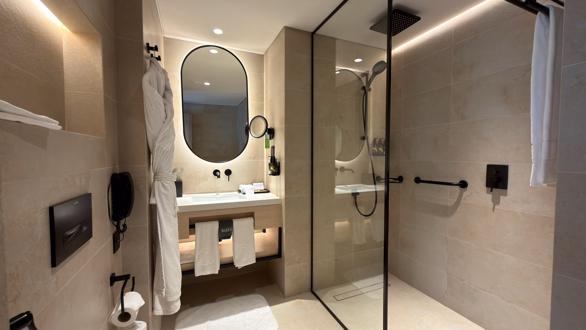 Selecting Accessible Boutique Hotels in Historic European Cities: A Practical Guide 2 Accessible hotel bathroom with safety grab bars and walk-in shower.
