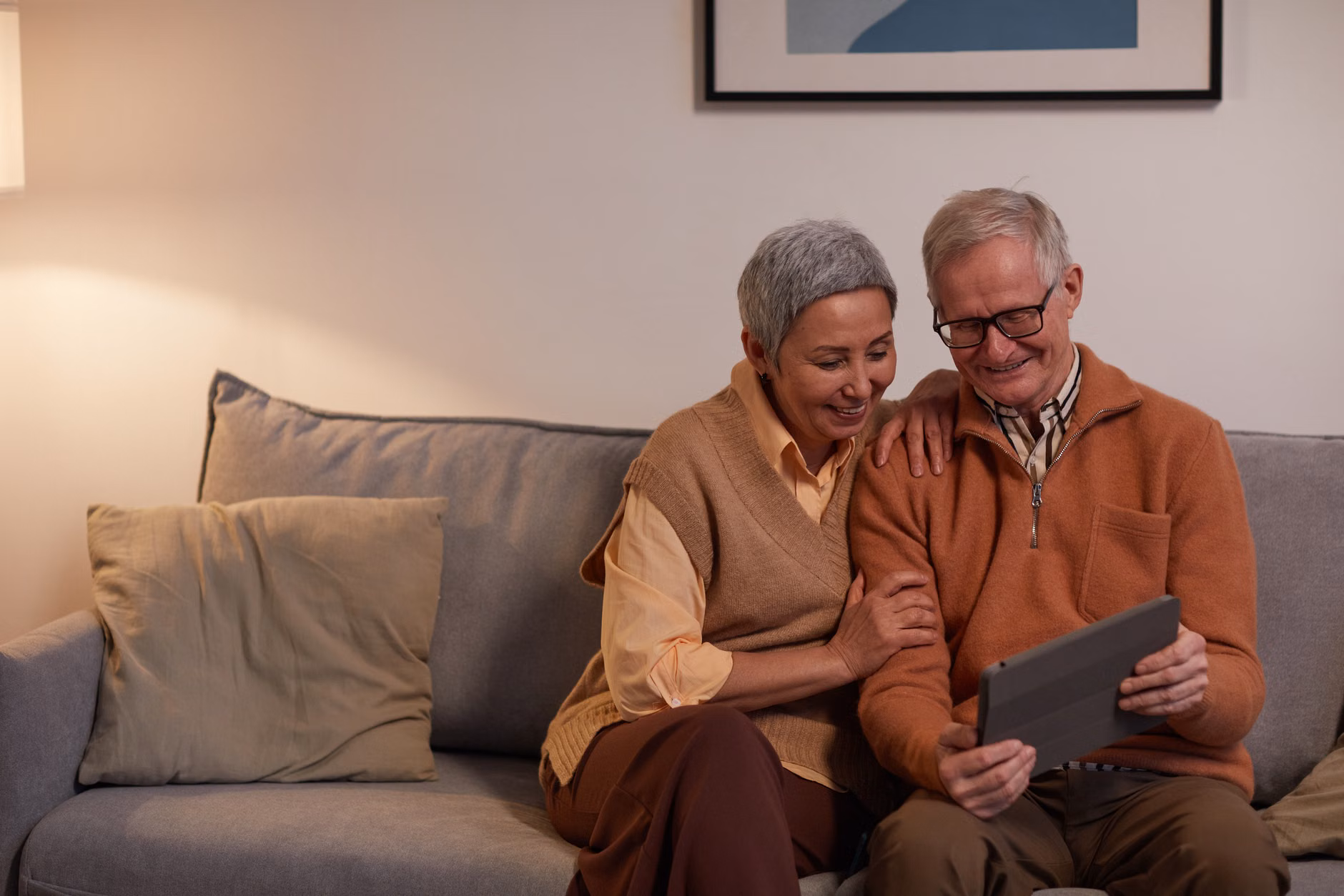 2026 Pension Verification: A Practical Guide to Digital Compliance 3 A senior couple reviewing digital information together on a tablet.