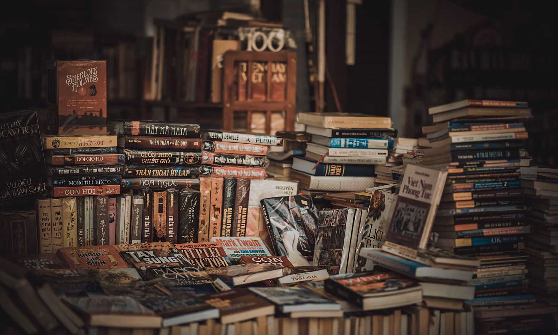 A variety of completed handmade books on a display shelf.
