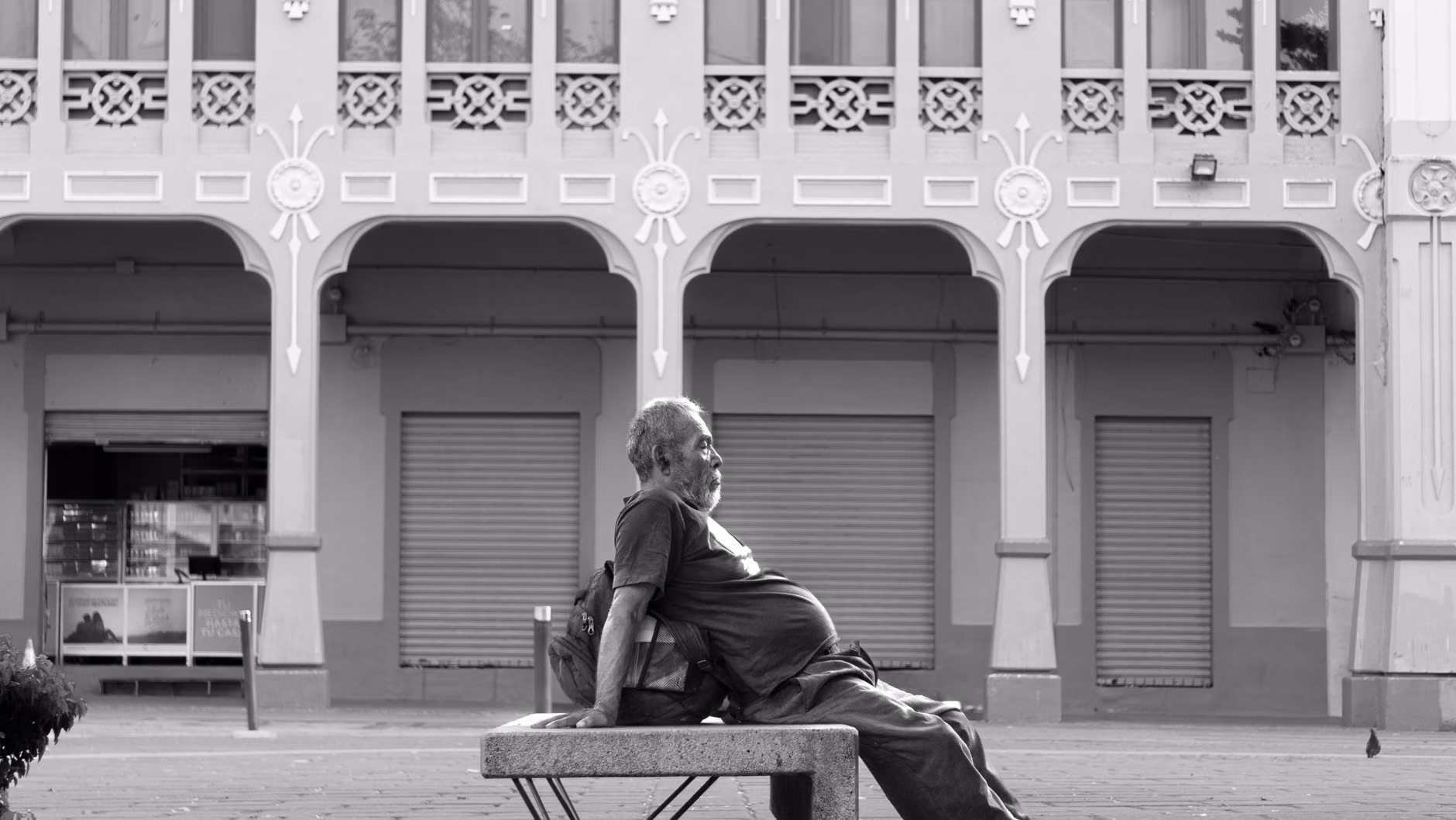 Senior-Friendly Rail Travel: A Practical Guide to Navigating Rural Historical Depots 3 A relaxed senior traveler resting on a bench at a quiet, historic rural train depot.
