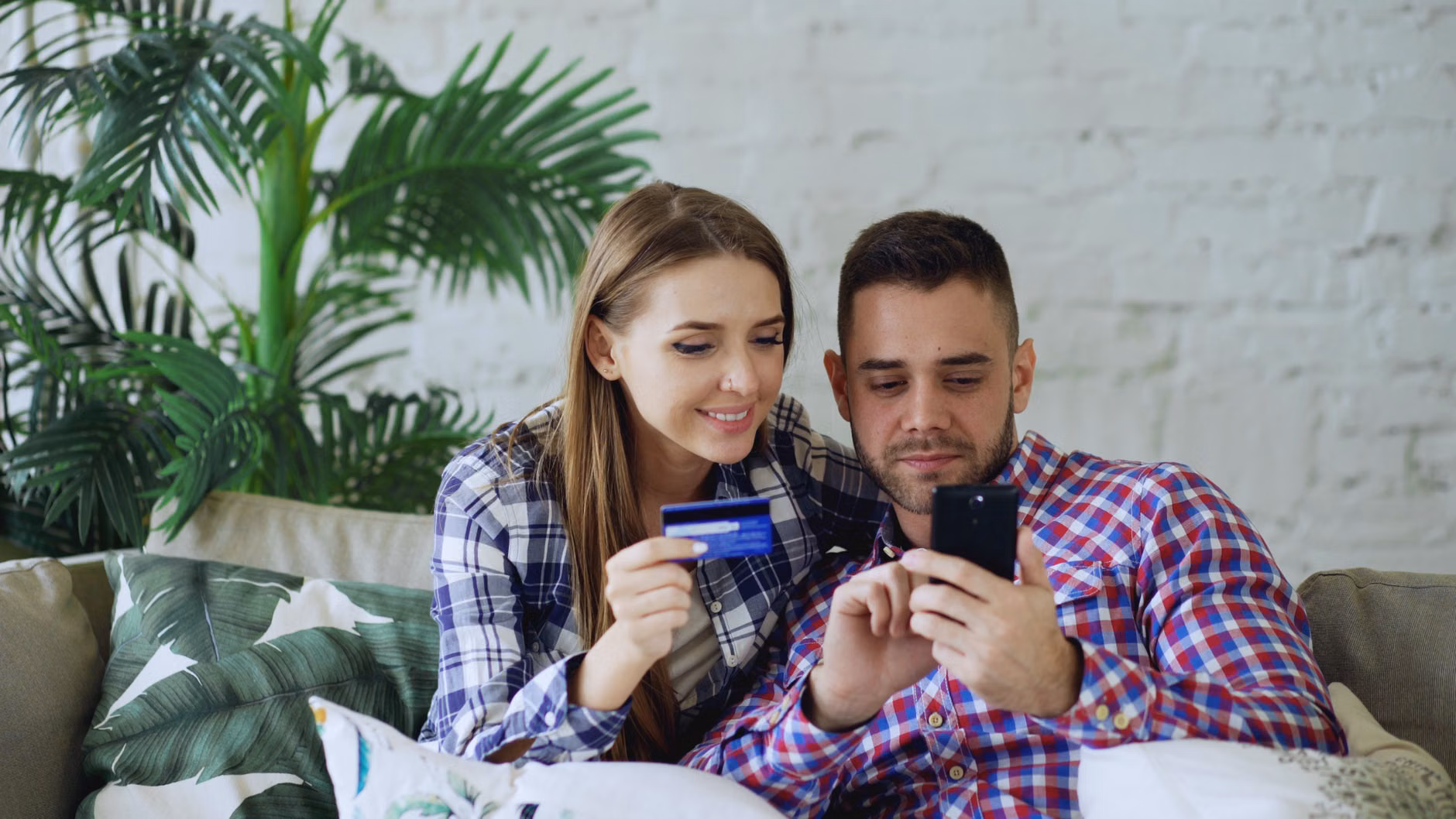 An older couple reviewing their digital security settings on a tablet.