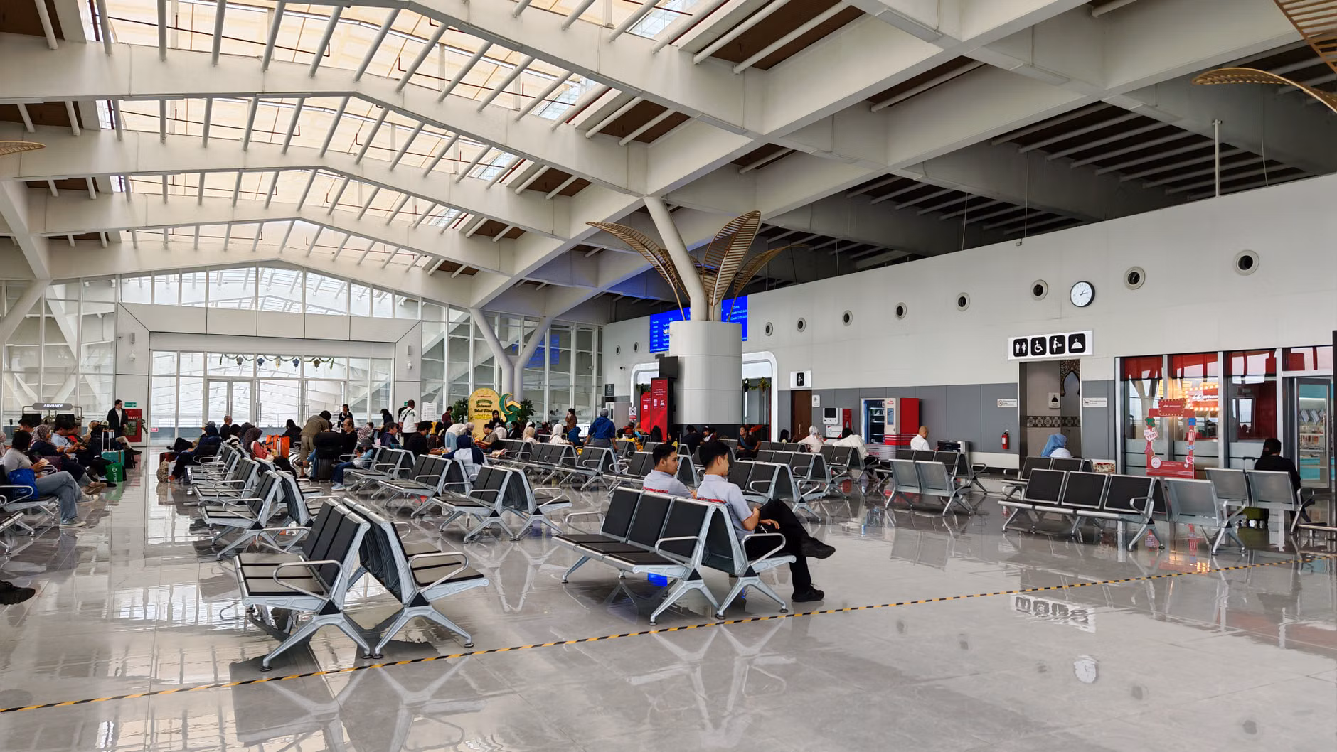 Mastering International Ferry Terminals: A Strategic Guide for Independent Travelers 3 Senior traveler resting on a terminal bench while consulting a map.