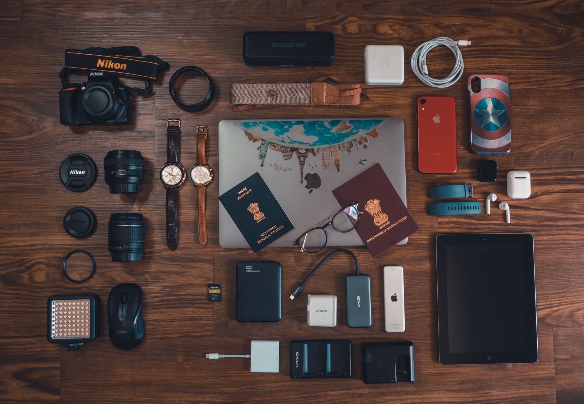 The Independent Traveler’s Guide: Mastering Offline Maps for Stress-Free Exploration 3 Travel essentials including a smartphone and power bank on a table.