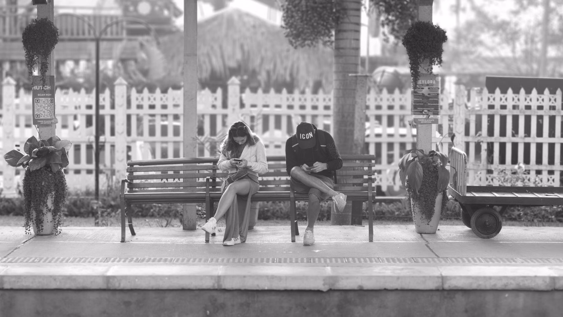 Senior couple navigating a train station using a mobile travel app.