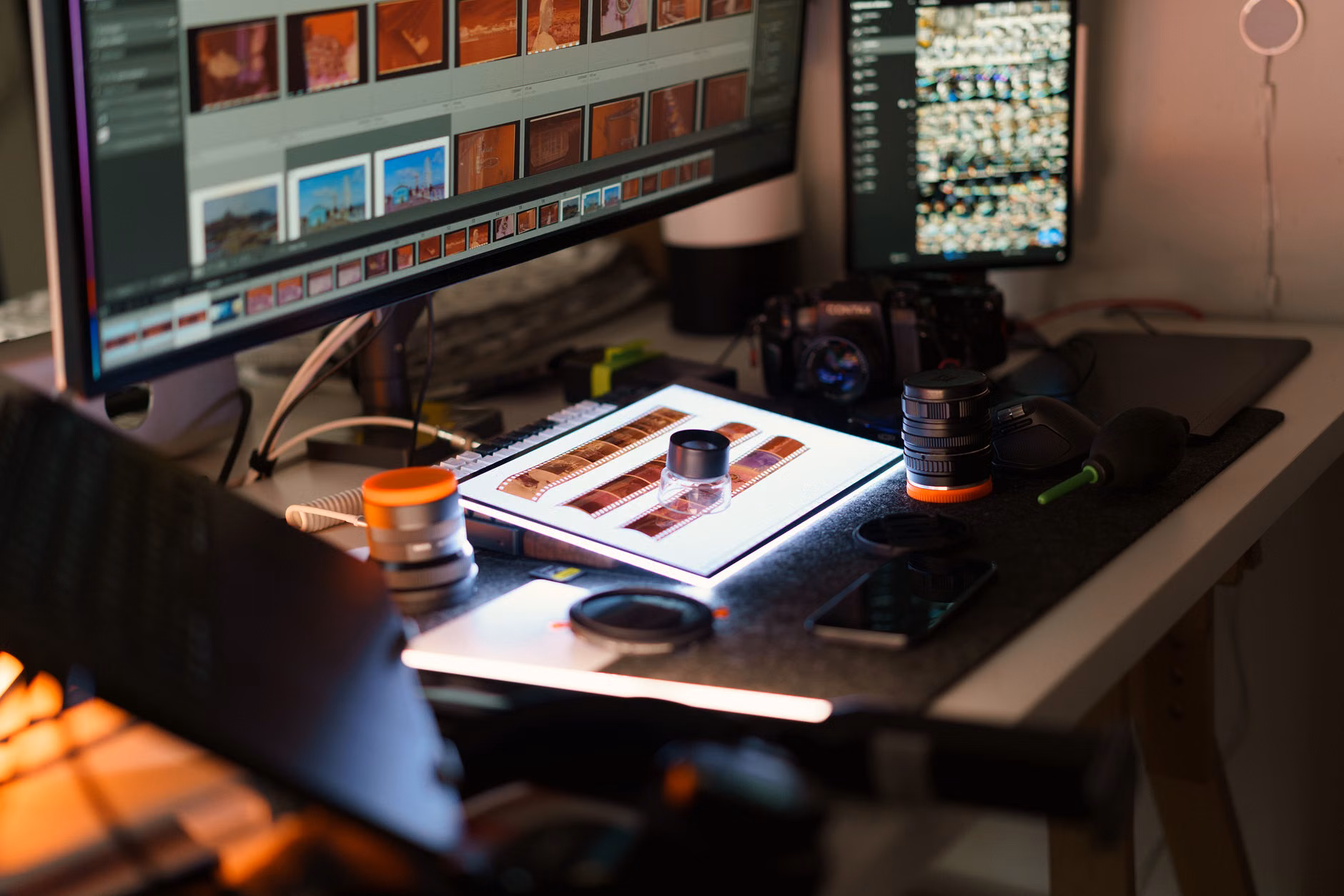 A home workspace setup for scanning and restoring family photographs.