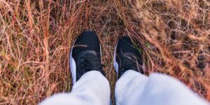 A pair of supportive walking shoes in a bright, comfortable home environment.