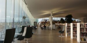 Modern library interior with comfortable seating designed for seniors.